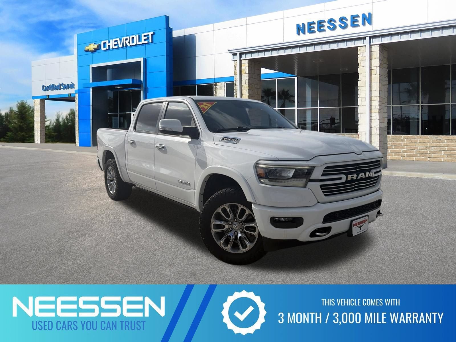 2021 RAM 1500 Laramie in Bright White Clea — front three-quarter view