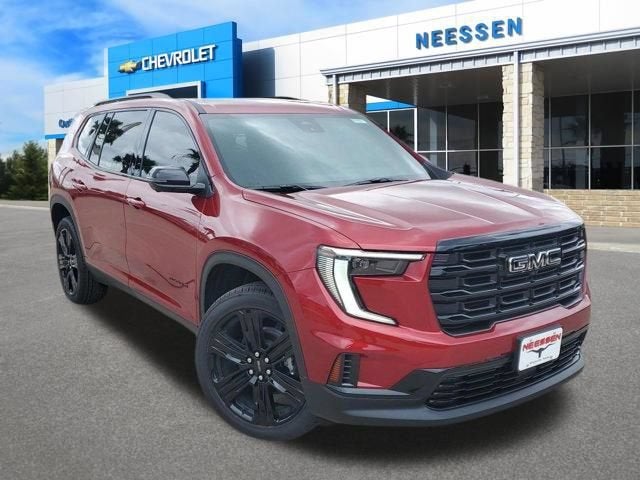 2026 GMC Acadia Elevation in Volcanic Red Tintcoat — front three-quarter view