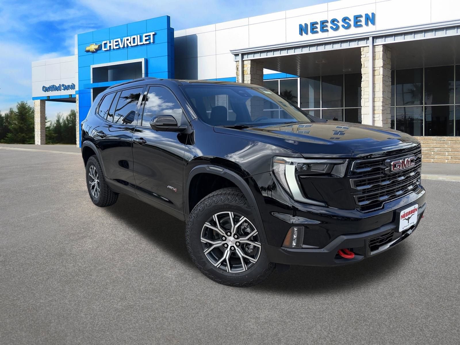 2026 GMC Acadia AT4 in Ebony Twilight Metallic — front three-quarter view
