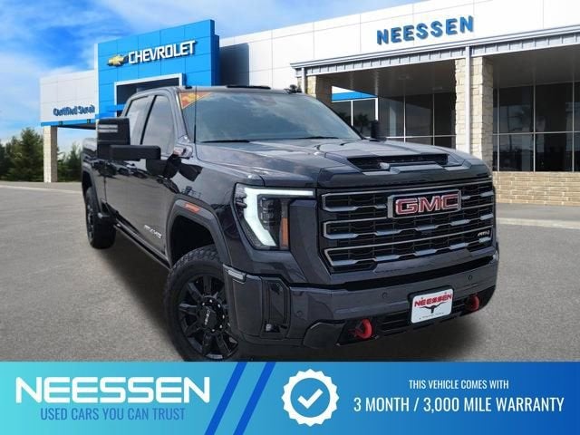2025 GMC Sierra 2500 HD AT4 in Titanium Rush Metallic — front three-quarter view