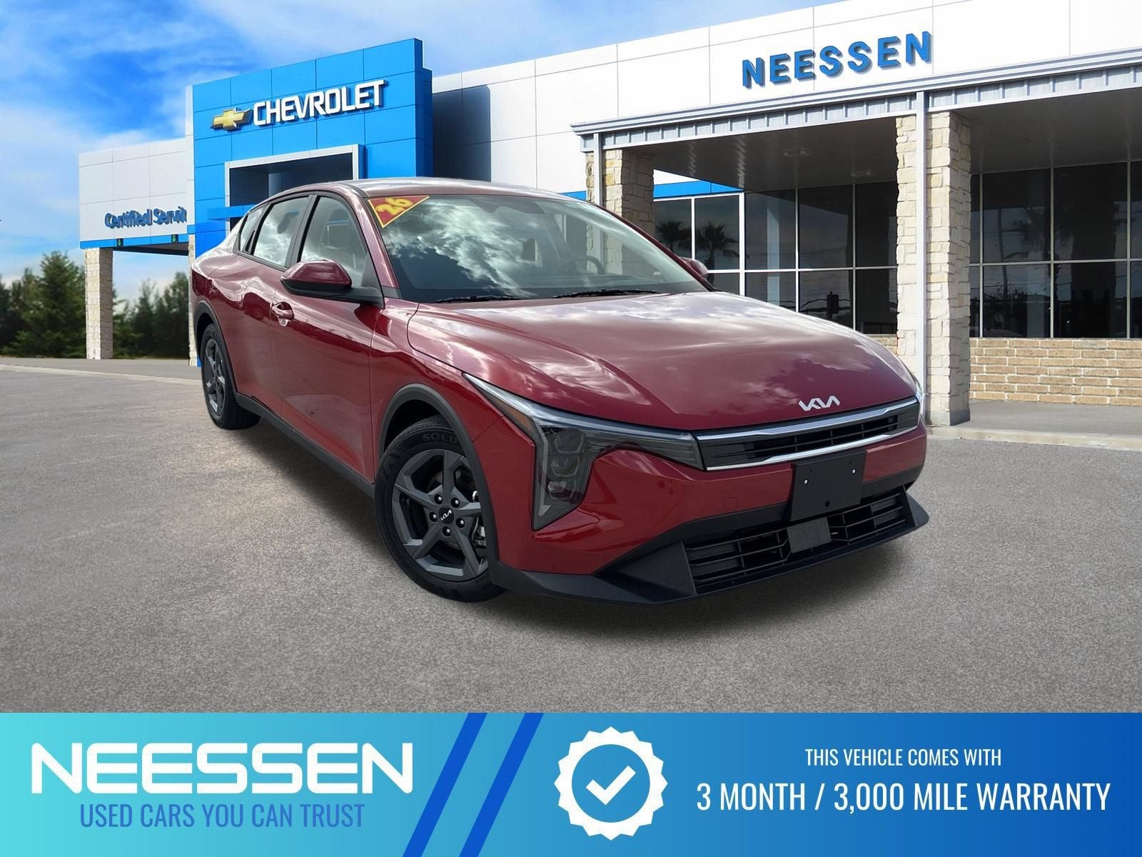2026 Kia K4 LXS in Currant Red — front three-quarter view