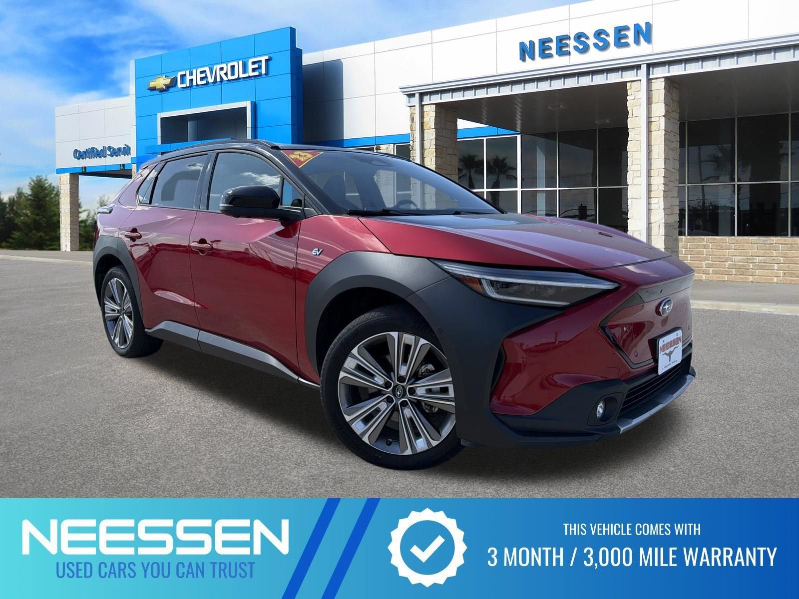 2023 Subaru Solterra Touring in Elemental Red P — front three-quarter view